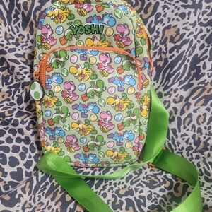 New Universal Studios Nintendo World Kids YOSHI Sling Backpack w/Green & Orange.